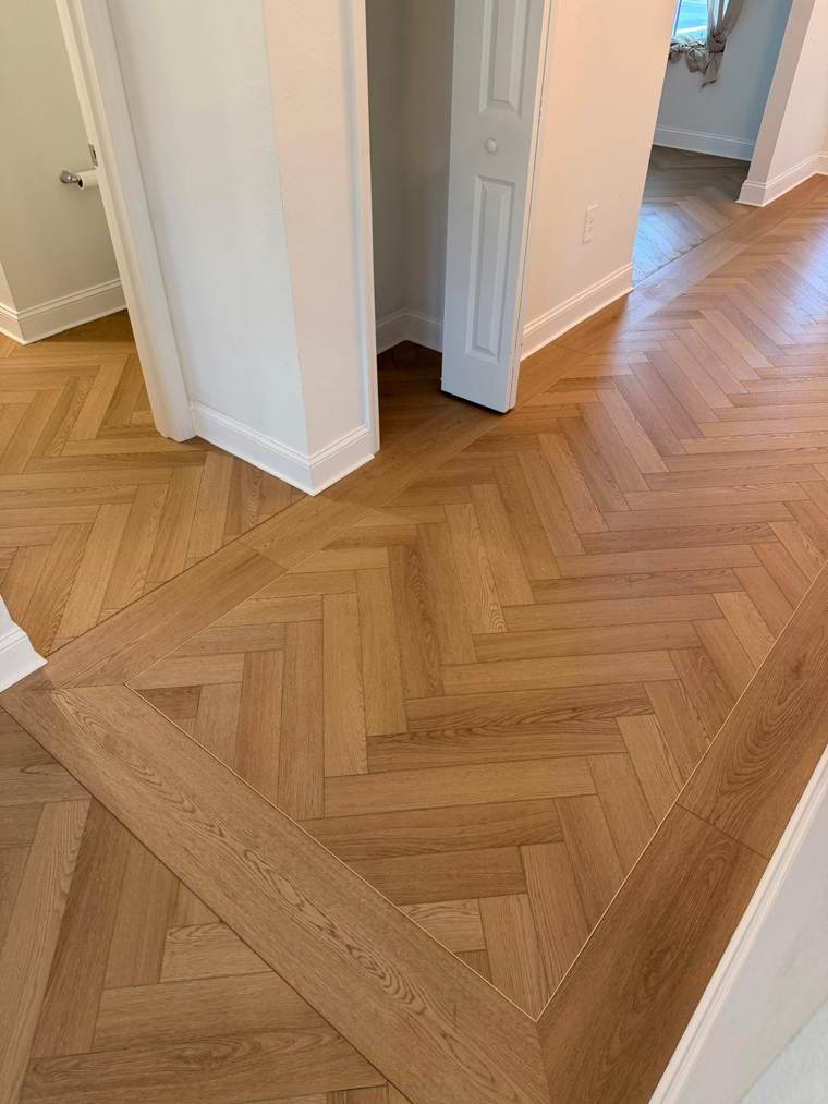 Herringbone floor with a plank border inlay